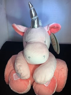 Unicorn holding pink blanket